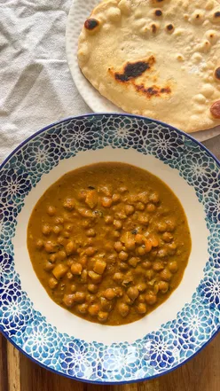 Delicious chickpea korma served with homemade flatbreads, perfect for quick and easy meals.