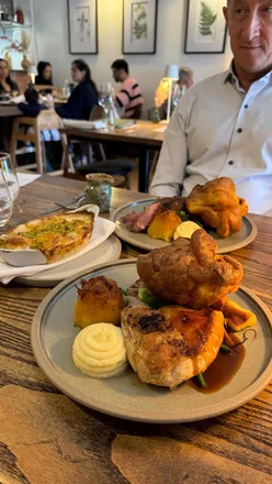 Delicious roasted chicken, lamb, and cauliflower steak with homemade sourdough and desserts at Lovage Jesmond.
