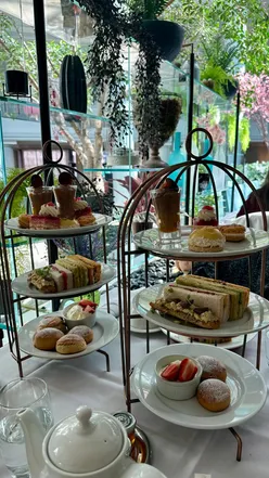 Delicious afternoon tea at Aria Restaurant, featuring pastries and strawberries, perfect for a special celebration.