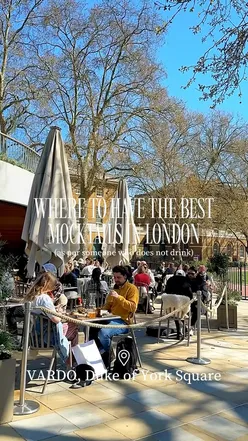 A vibrant Rhubarb Cooler mocktail at Sloane Square, perfect for spring alfresco dining with matching nails.