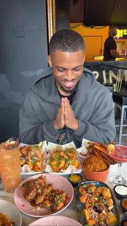 Bottomless brunch at Chips N Dat in Dalston featuring shrimp, wings, loaded fries, and fun cocktails.