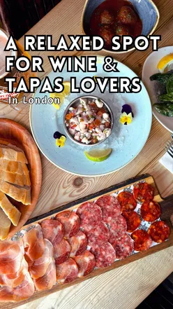 Tapa Tapa near ExCeL London offers Spanish tapas like cured meats, spinach croquetas, ceviche, scallops, and gin sorbet.