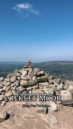 Scenic view of Cow & Calf rocks on Ilkley Moor, West Yorkshire, under a clear spring sky, ideal for a refreshing walk.