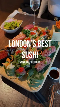 Brother enjoying beautifully presented sushi at Sanjugo, an authentic Japanese restaurant in London Victoria.