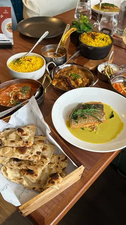Chef Atul Kochhar demonstrating easy, flavorful Indian recipes at Kanishka, London masterclass event.