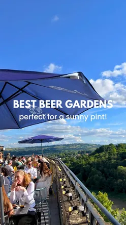 Enjoying a sunny pint in Bristol's best beer gardens, featuring lush greenery and vibrant social scenes.