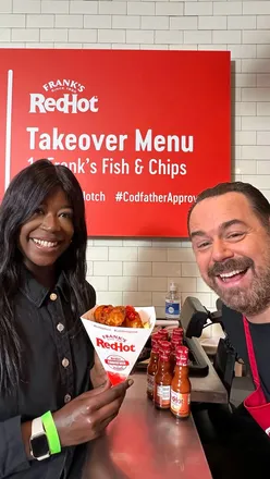Delicious fish and chips with Frank's RedHot sauce batter, served by The Codfather, enhancing a classic UK meal.