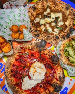Pizza Pilgrims Leeds feast: You’ve Got Maiale pizza with prosciutto, nduja, salsiccia, pepperoni, burrata, balsamic; Genovese King pizza with beef sauce, provola, Pecorino; Cacio e Pepe Balls, Smoked Mozzarella Bites, Garlic Flatbread, Amalfi Lemonade, Sicilian Lemon Sorbet.