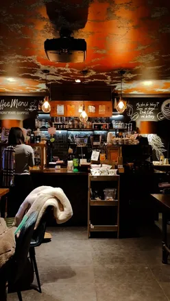 Cozy speakeasy cafe in Edinburgh with creative latte art and unique decor, perfect for coffee lovers.