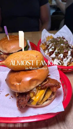 Delicious Unfairground burger with waffle fries and milkshake at Almost Famous, Manchester.
