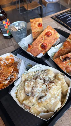 Delicious pasta and focaccia at a new eatery in Edinburgh, featuring a cozy atmosphere and vibrant vibes.