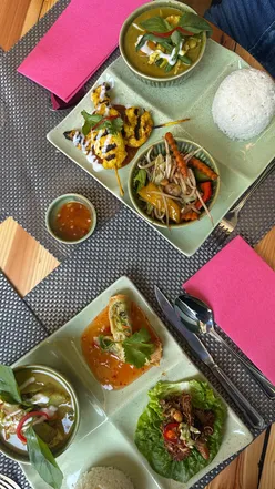 Delicious Thai food beautifully presented at Giggling Squid, a spacious new venue in Leeds with cozy decor.