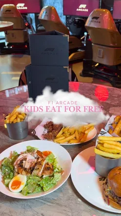 Delicious chicken Caesar salad, double beef burger, and halloumi fries at F1 Arcade, perfect for kids and families.