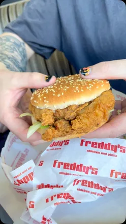 Delicious fried chicken feast with burger, wings, fries, and cheesy pizza from Freddy's London Road, Sheffield.