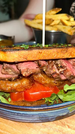 Delicious pub grub at Church on the Hill: Beef Bourguignon pie, steak sandwich, mozzarella sticks, and onion rings.