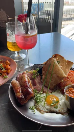 Brunch at 3Sixty Newcastle with views, featuring a strawberry lemongrass cocktail and full English breakfast.