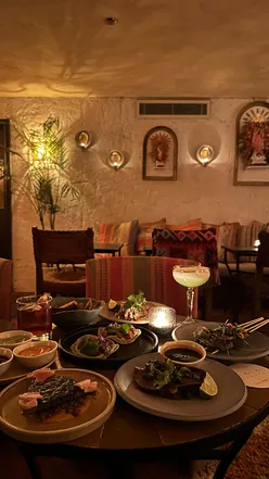 Enjoying mezcal cocktails and Mexican street food like tacos and tostadas at El Bar de Cavita in Marylebone.