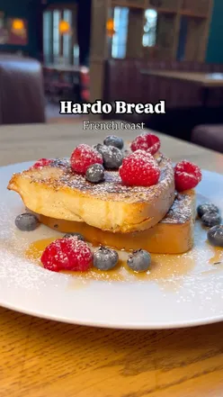 Delicious hardo bread French toast topped with fresh berries at Original Flava, London brunch spot.