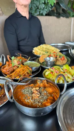 Cocktails and Indian small plates at Tadka Sandyford, featuring onion bhaji, chicken 65, and unique seasonal dishes.
