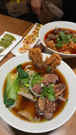 Delicious grilled vegetable gyoza, spicy prawn, and beef noodle soups at Super Bowl Noodle Bar in London.