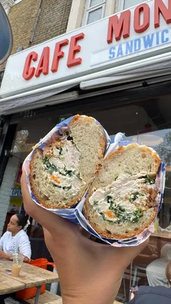 Turkey Caesar and Mondo Frango subs in sesame bread at a cozy Camberwell cafe with outdoor seating.
