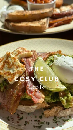 Brunch at The Cosy Club Leeds: smashed avocado with poached egg, halloumi, bacon, butchers brunch, green juice, berry smoothie.