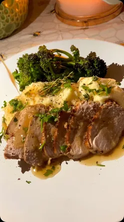 Delicious pork tenderloin with buttery mash and steamed broccoli, topped with homemade pan gravy.