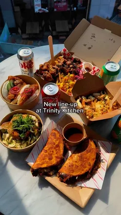 Delicious street food at Trinity Kitchen Leeds: tacos, burrata, poutine, munch box, and bao buns.