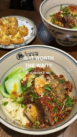 A bowl of hand-pulled noodles from Noodle Inn, London's popular new noodle spot, garnished and steaming hot.