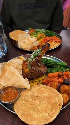 Delicious Indian Sunday Roast served at Chakhdhoom in Jesmond, showcasing vibrant flavors and spices.