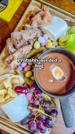 Delicious Creme Egg fondue with waffles, fruits, and marshmallows, perfect for sharing at Brel Bar, Glasgow.