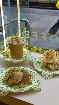 Delicious Lebanese pistachio ice cream topped with crunchy pistachios and served with kunafa and baklava.