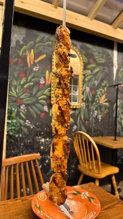 Delicious Skewer House meal: flamed chourico, chicken skewer, and mini egg cheesecake in Taunton, Somerset.