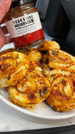 Cheese and red pepper relish pinwheels made with puff pastry, perfect for lunchboxes and packed with flavor.