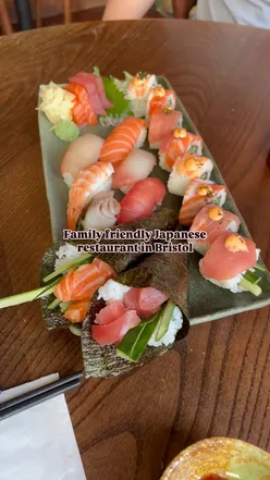 Family enjoying sushi and a kids bento box at Kibou Restaurant in Clifton Village, Bristol.