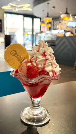 Delicious desserts at Creams Cafe Bristol: waffles, hot doughnuts, and milkshakes, perfect for a birthday treat.