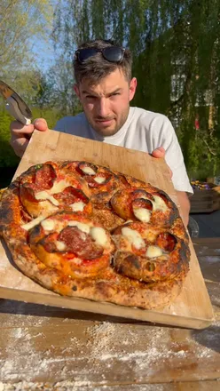 Delicious pizza topped with mini pizzas and seasoned with Pizza^2 for an extra flavorful bite.