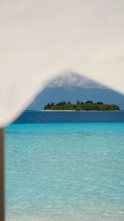 Private sandbank picnic in the Maldives with delicious treats and ocean views, perfect for a romantic getaway.