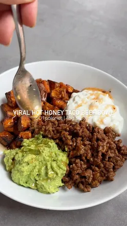 Delicious hot honey beef taco bowl with sweet potato, avocado, and cottage cheese, showcasing a nutritious meal trend.