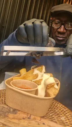 Delicious truffle fries topped with truffle cheese at Turnips Borough Market in London.