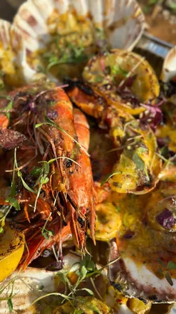 Seafood sharing platter with crispy halloumi fries at The Rock and Scallop, near Southerndown beach, perfect for three.
