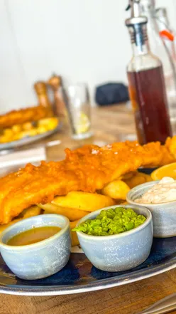 Delicious fish and chips enjoyed at Beach House, Seahouses, perfect for Good Friday celebrations.