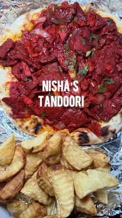 Delicious tandoori dishes served at Nisha's Tandoori in Newcastle, showcasing vibrant Indian cuisine.