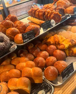 Shinjuku's Morethan Bakery in The Knot Tokyo offers fresh bagels, focaccia, mini shokupan, and banana bread with Hokkaido butter.