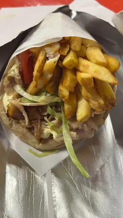Tasty Greek gyros from Mr. Souvlaki at Five Valleys, Gloucester, featuring delicious flavors and a vibrant atmosphere.