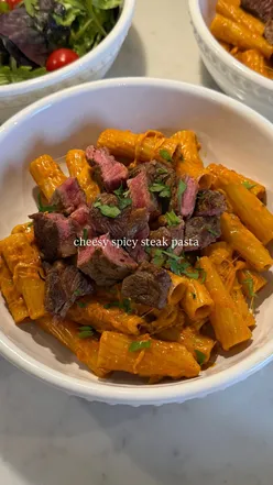 Cheesy spicy steak pasta with rich sauce, perfect for a cozy dinner. Indulgent meal idea for date night or family dinner.
