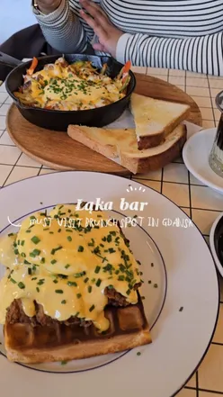 Brunch at Laka Happy Bar in Gdansk: buttermilk chicken, poached egg, chorizo hash, and delicious coffee.