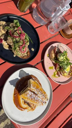 Brunch at Mercy Bristol featuring creamy tarragon mushrooms, eggs Benedict, and banana caramel French toast outdoors.