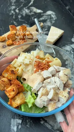 Delicious chipotle chicken caesar pasta salad with crunchy garlic croutons, perfect for healthy meals.