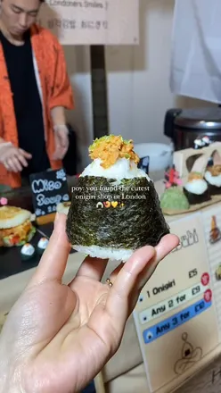 Freshly made onigiri and rice burgers at Brick Lane Truman Markets, showcasing delicious Japanese street food.